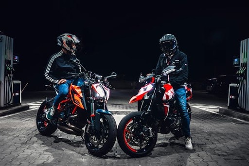 free-photo-of-two-men-sitting-on-motorcycles-at-ni